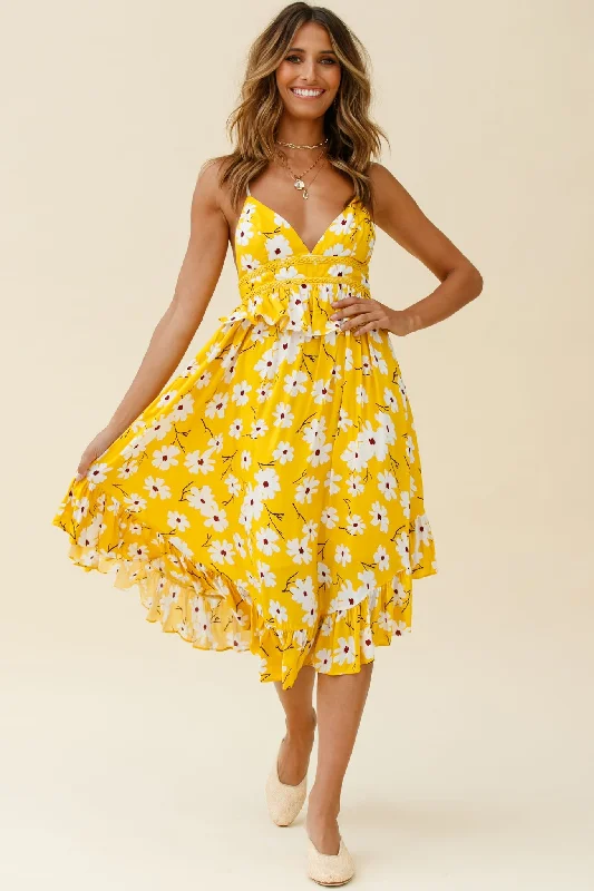 Midi dresses with geometric cutouts for a contemporary and edgy look Marigold Peplum Midi Ruffle Dress Floral Print Yellow Midi dresses with geometric cutouts for a contemporary and edgy look Marigold Peplum Midi Ruffle Dress Floral Print Yellow