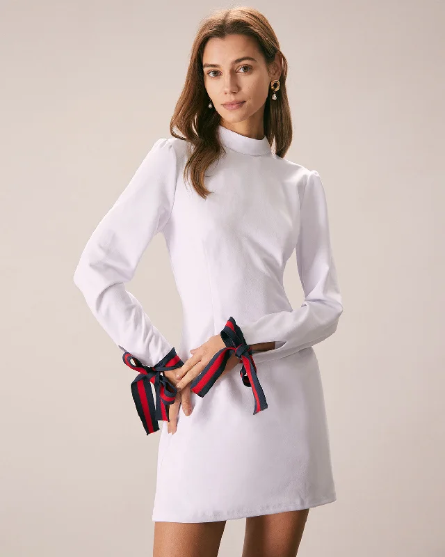 Mini dresses with mesh panels for a sexy and trendy look The White Mock Neck Bowknot Cuff Mini Dress Mini dresses with mesh panels for a sexy and trendy look The White Mock Neck Bowknot Cuff Mini Dress