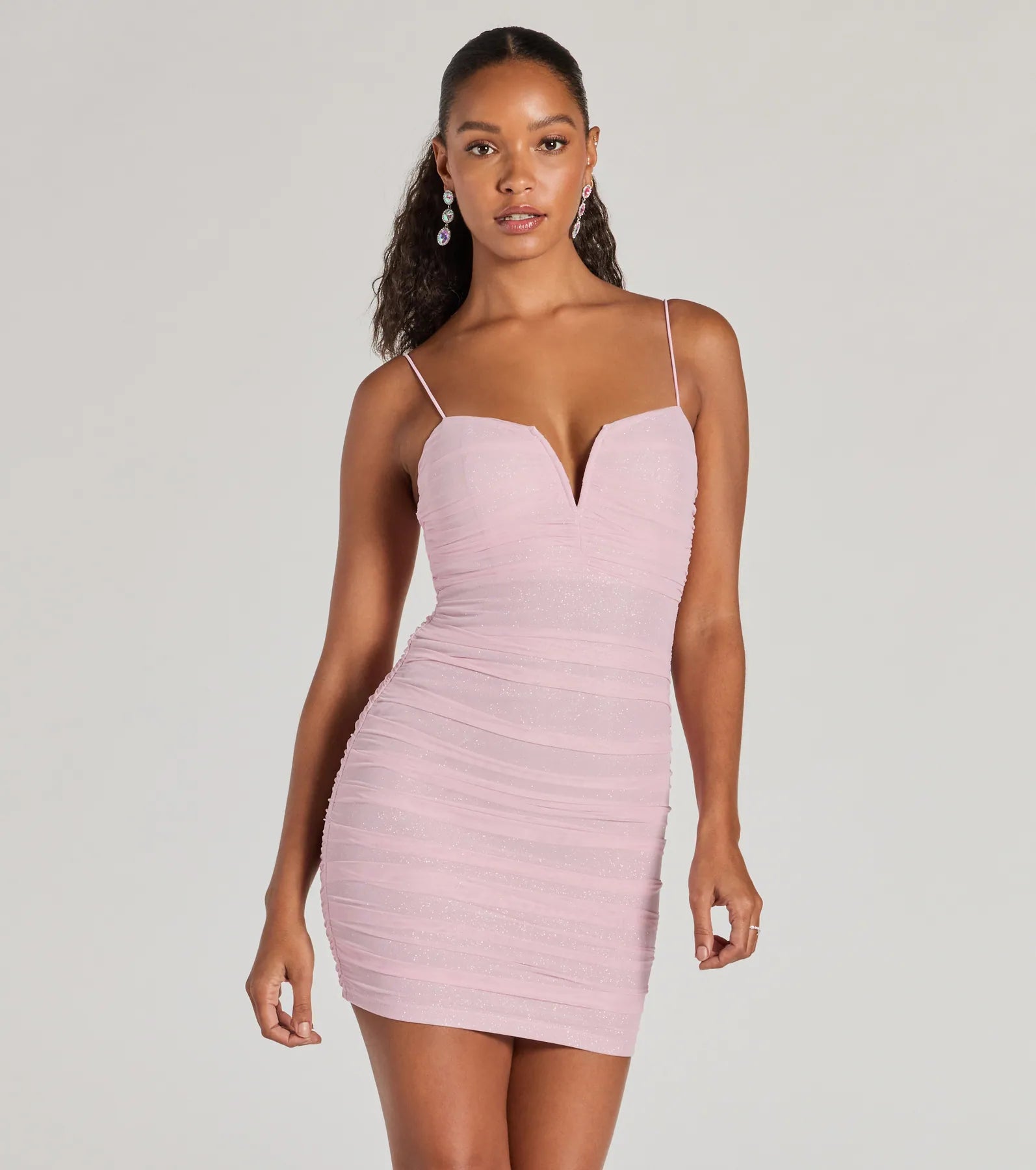Mini dresses with tassel accents for a fun touch Sparkling Glow V-Neck Bodycon Glitter Mini Dress Mini dresses with tassel accents for a fun touch Sparkling Glow V-Neck Bodycon Glitter Mini Dress