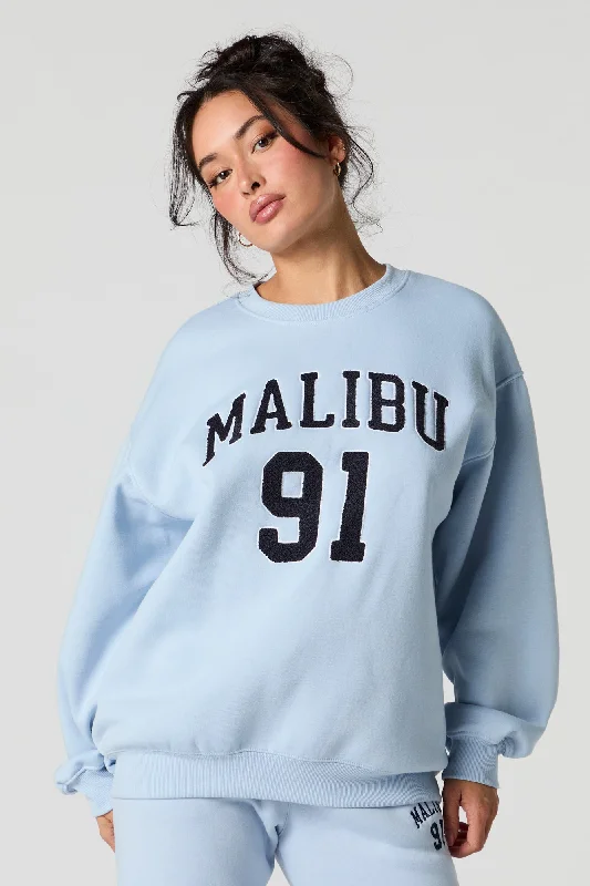 Women's cropped sweatshirt with a slogan graphic for a fun and expressive lookDestination Embroidered Fleece Sweatshirt Women's cropped sweatshirt with a slogan graphic for a fun and expressive lookDestination Embroidered Fleece Sweatshirt