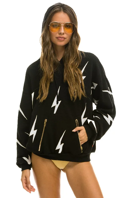 Women's pullover hoodie with a side slit for a modern and relaxed fitBOLT STITCH REPEAT RELAXED PULLOVER HOODIE WITH POCKET ZIPPERS - BLACK // WHITE Women's pullover hoodie with a side slit for a modern and relaxed fitBOLT STITCH REPEAT RELAXED PULLOVER HOODIE WITH POCKET ZIPPERS - BLACK // WHITE