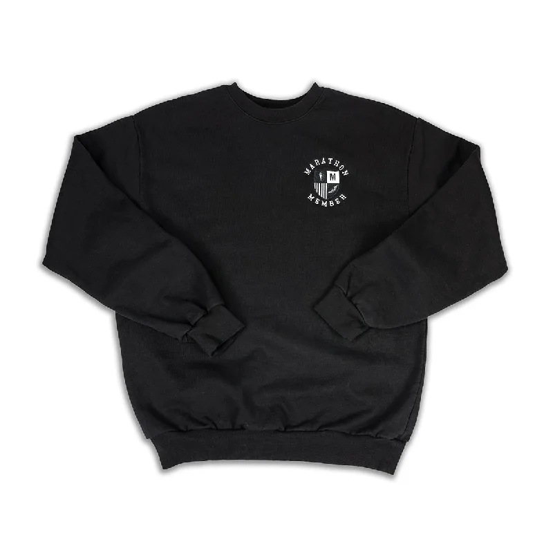 Women's pullover hoodie with a side slit for a modern and relaxed fitMarathon Members Crewneck Sweatshirt - Black Women's pullover hoodie with a side slit for a modern and relaxed fitMarathon Members Crewneck Sweatshirt - Black