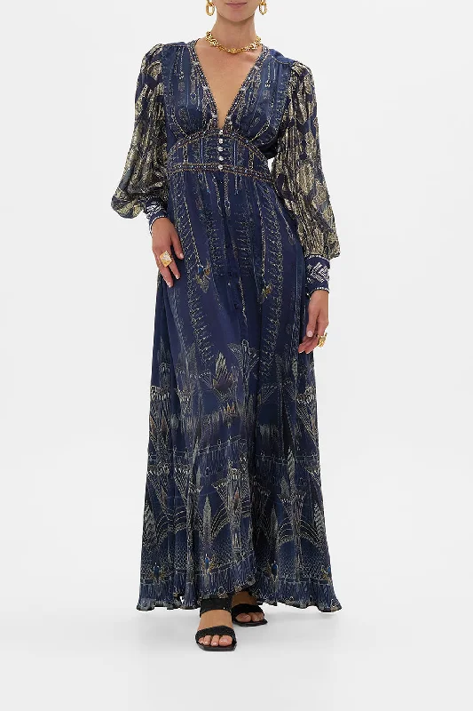 Maxi dresses with pom - pom trims for a playful and festive lookSHAPED WAISTBAND DRESS WITH GATHERED SLEEVES THE EGYPT EFFECT Maxi dresses with pom - pom trims for a playful and festive lookSHAPED WAISTBAND DRESS WITH GATHERED SLEEVES THE EGYPT EFFECT