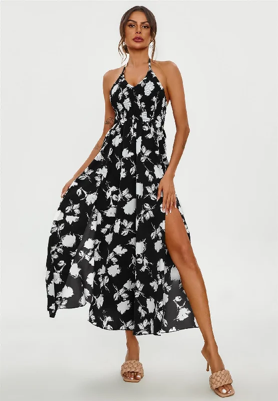 Maxi dresses with fringe trim for a bohemian vibeFloral Print Tie Halterneck Back Detail Maxi Dress In Black Maxi dresses with fringe trim for a bohemian vibeFloral Print Tie Halterneck Back Detail Maxi Dress In Black