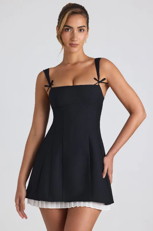 Mini dresses with fringe for a bohemian styleBow-Detail Pleated A-Line Mini Dress in Black Mini dresses with fringe for a bohemian styleBow-Detail Pleated A-Line Mini Dress in Black